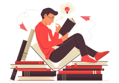 man reading a book and thinking